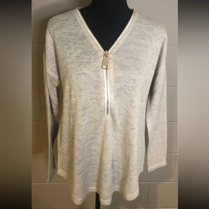 Beige sweater with gold zipper